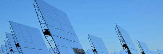 bifacial solar panels against a blue sky