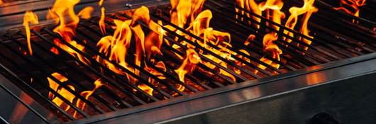 Barbecue gas grill with flames coming up 
