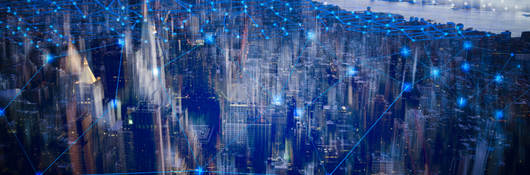 A city with blue interconnected lines showing digital connections.