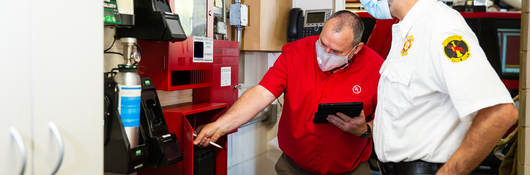 People inspecting a fire system