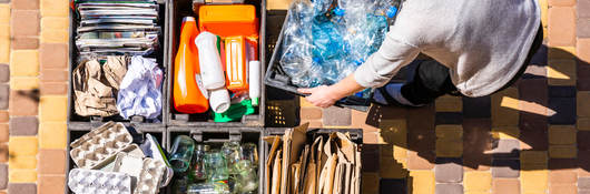 Woman sorts materials for recycling