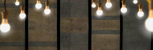 Light bulbs hanging in cement room