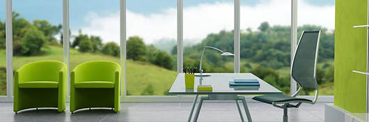 Open workspace with a desk and a view of the outside