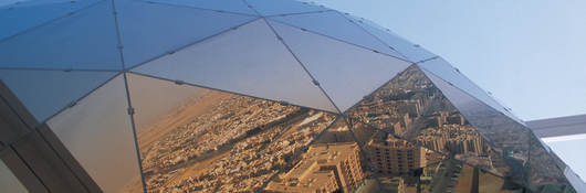 Glass prism reflecting city of Saudi Arabia