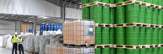 Warehouse with green barrels  