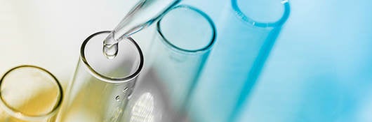 Test Tubes having liquid dripped into them.