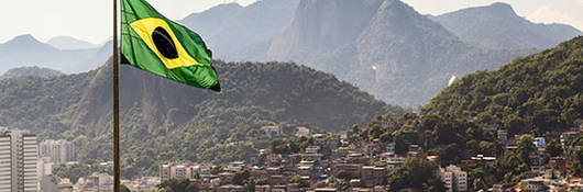 Brazilian flag flying over countryside view