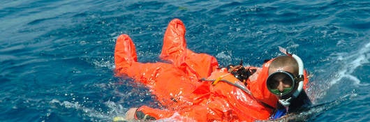 A diver rescuing a sailor