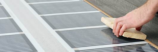 Person laying hardwood floor