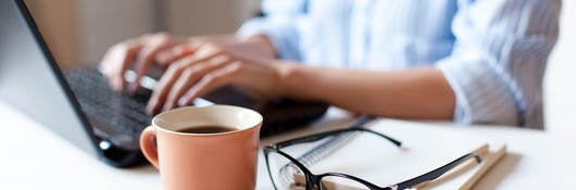 woman typing on a laptop