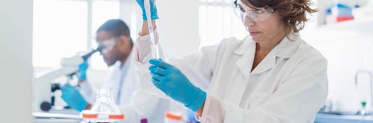 Concentrated chemist working on chemicals