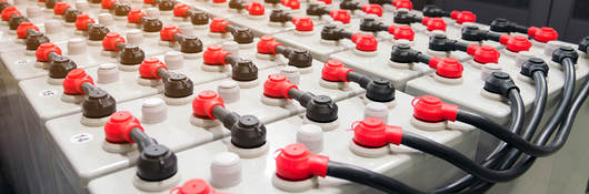 Rows of battery packs in industrial backup power system