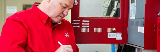 UL employee checking a fire alarm system