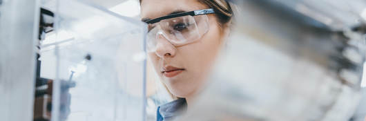 Female industrial worker working in manufacturing