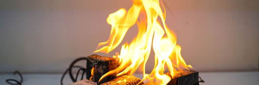 Electrical short circuit causing a fire on an overloaded power strip
