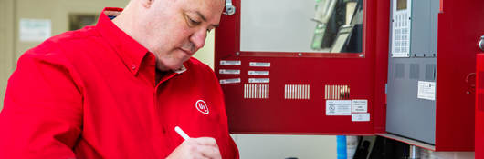 Employee checking off on checklist on a clipboard