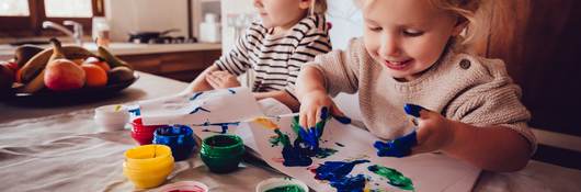 Children playing with finger paints