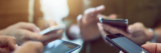 Colleagues using their smartphones