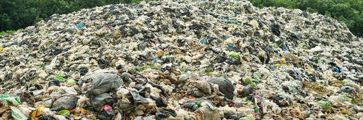 A large landfill heaped with trash.