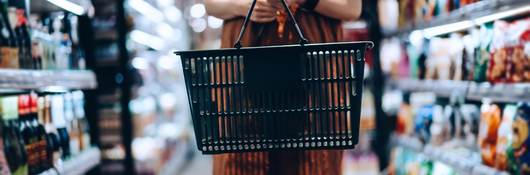 Woman carrying a shopping basket