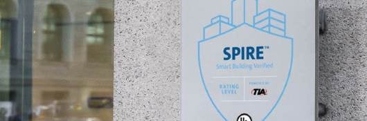 SPIRE Smart Building Verified Assessment plague at eye level on modern building