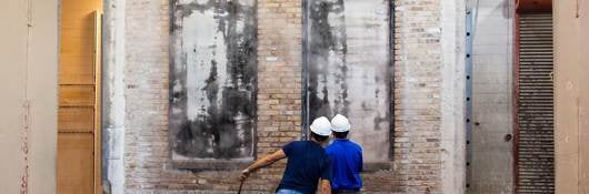 Two UL engineers test fire doors