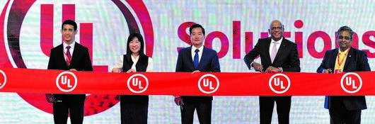 Officials from the Vietnam government and leaders from UL Solutions cut ribbon at opening ceremony for new laboratory