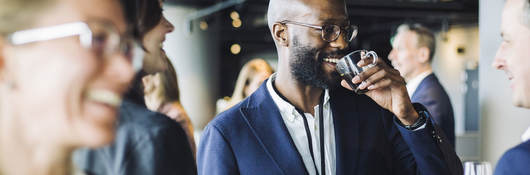 Person at event drinking coffee 
