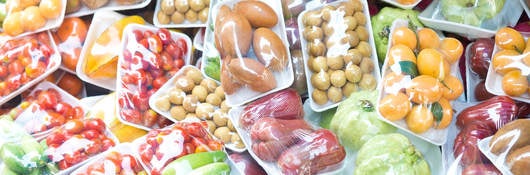 assorted wrapped packages of various fruits and vegetables