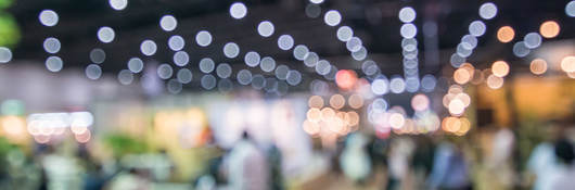 Abstract image of people at a tradeshow