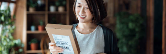 Woman holding two packages