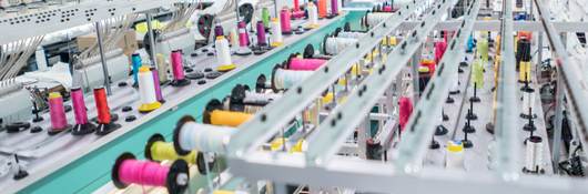 Embroidery machine at a clothing factory.