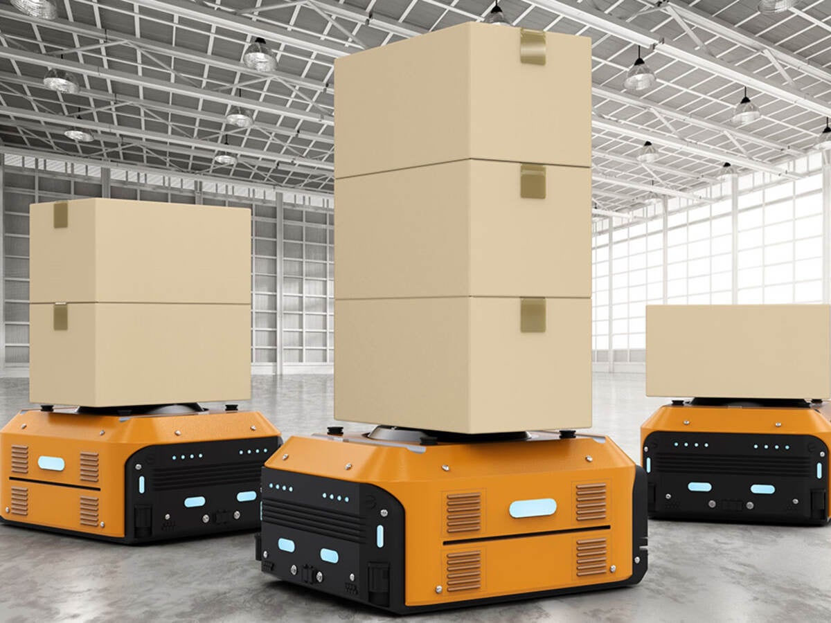 Yellow AGVs move boxes around warehouse