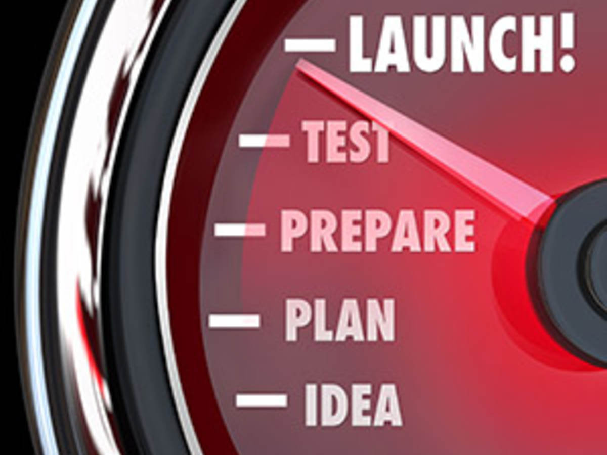 launch word on a red speedometer with needle racing past idea, plan, prepare and test.