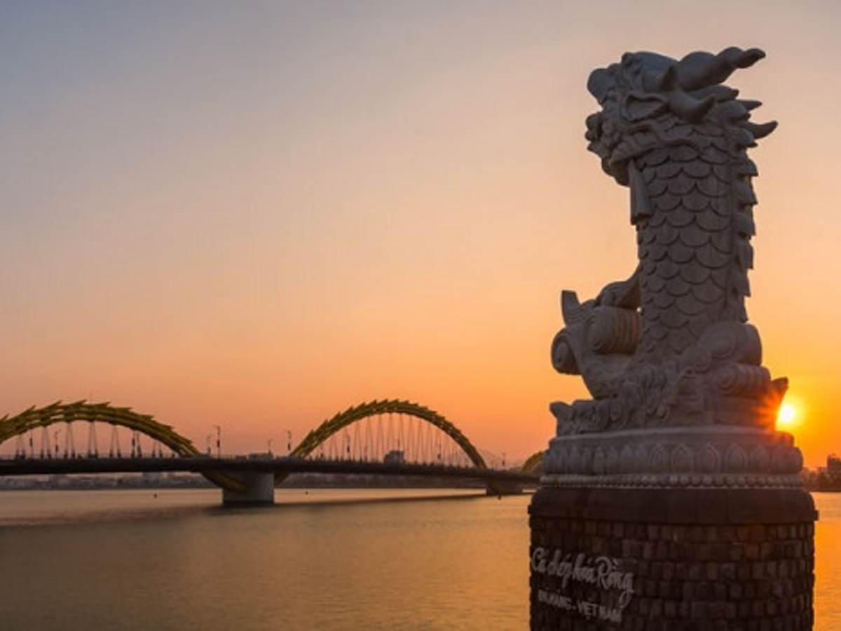 view of the dragon bridge over the water in da nong, vietnam