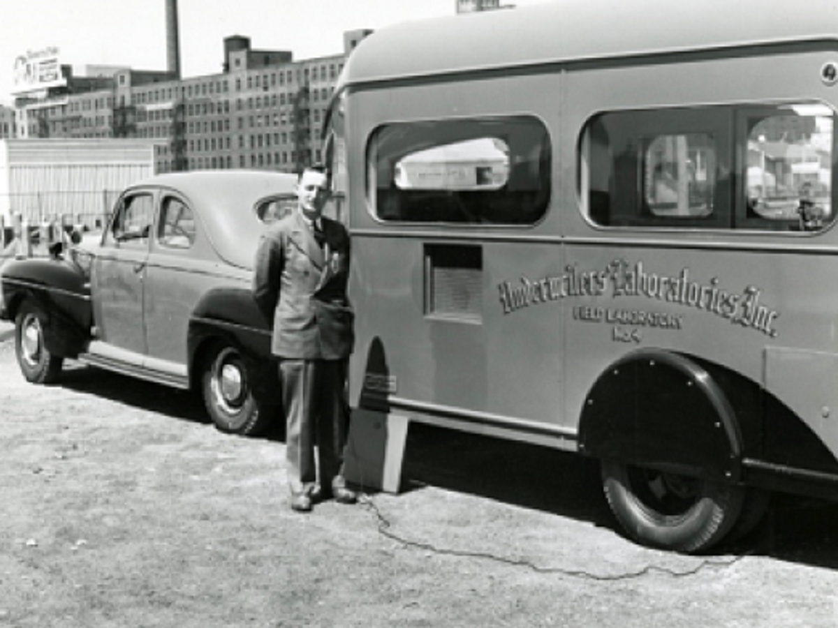 Hilton bus image, UL Presdient Dana Pierce, UL engineer CJ Krieger, lemont left, lemont middle, Lemont right, Pierce and Small, Group of employees outside San Fran, UL building, UL company picnic, UL Presdient Dana Pierce, UL engineer CJ Krieger, lemont left, lemont middle, Lemont right, Pierce and Small, Group of employees outside San Fran, yellow letter