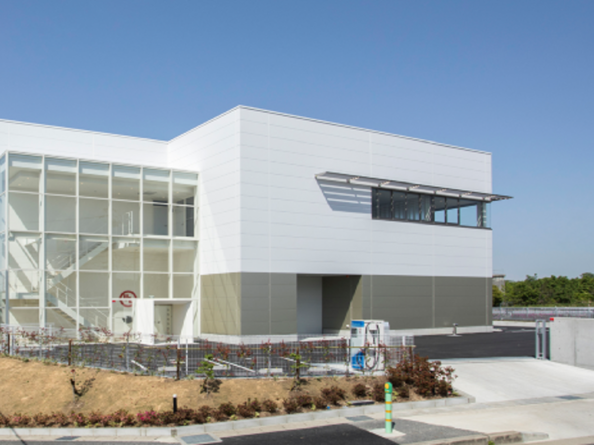 Modern white building with glass front. UL's ATC division in Japan.
