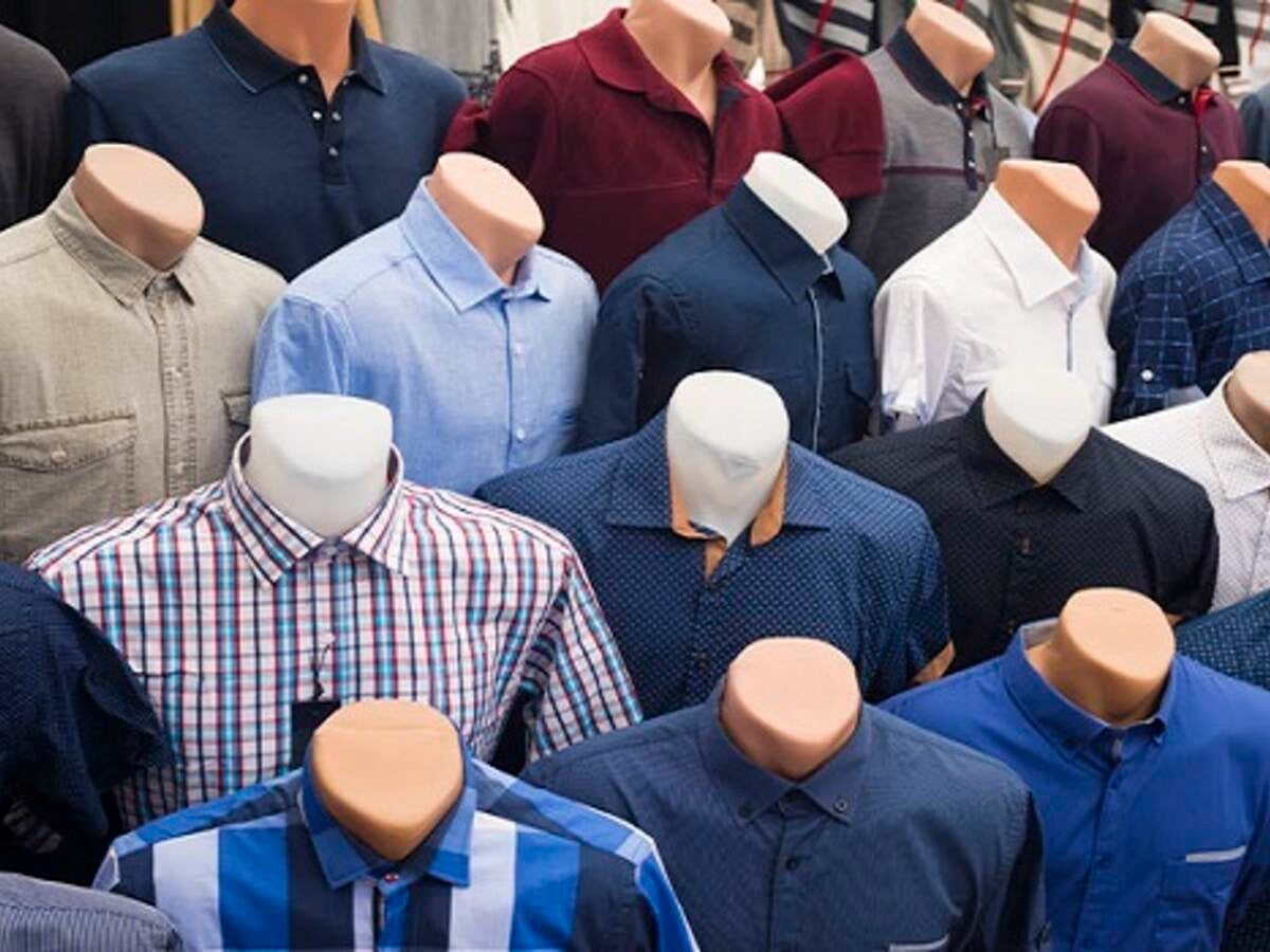 66518597 - the range of men's shirts on mannequins in the market (selective focus)