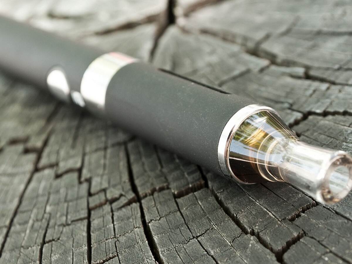 closeup of black e-cigarette on wooden background