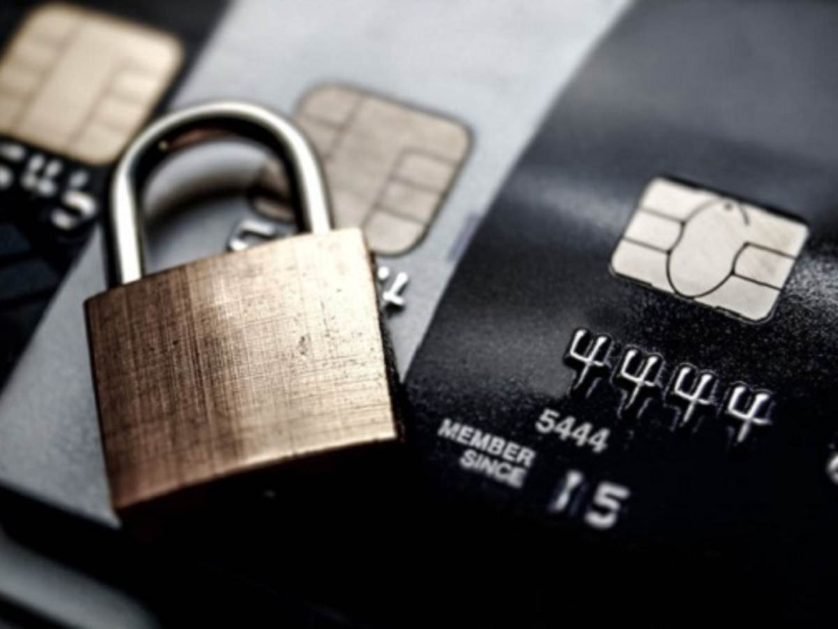 credit card with a closed gold lock laying on top of it