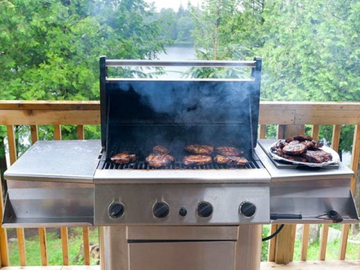Steaks cooking on a gas grill