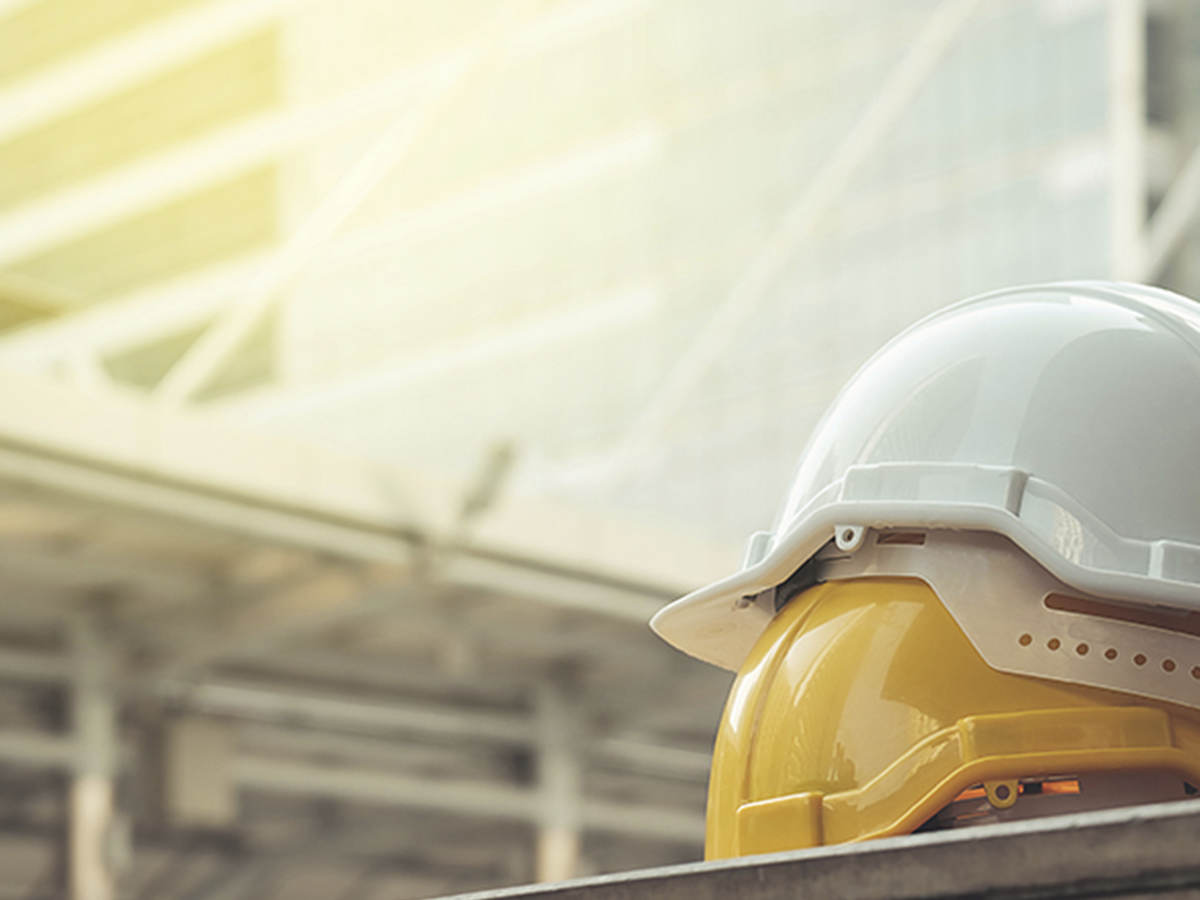 Image of yellow and white hard hats.