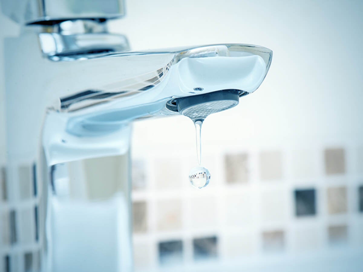 water tap and water dripping from it