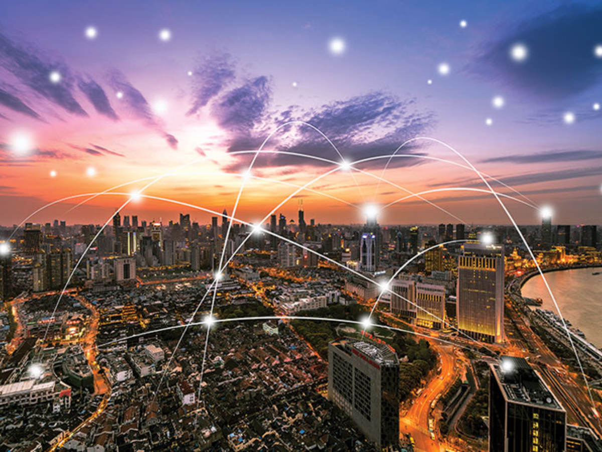 Cityscape at night with cyber web interconnecting building