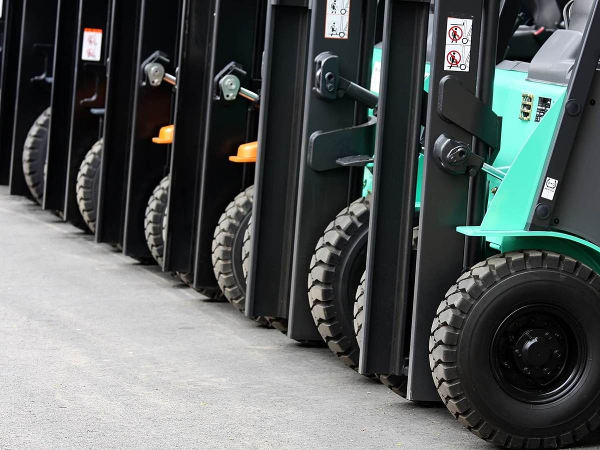 Multiple forklifts in a row in warehouse