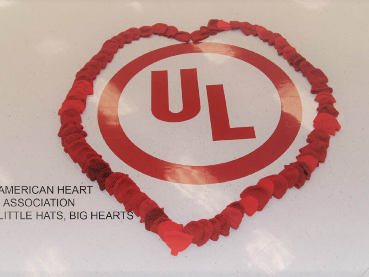 UL logo enclosed within red hats in the shape of a heart