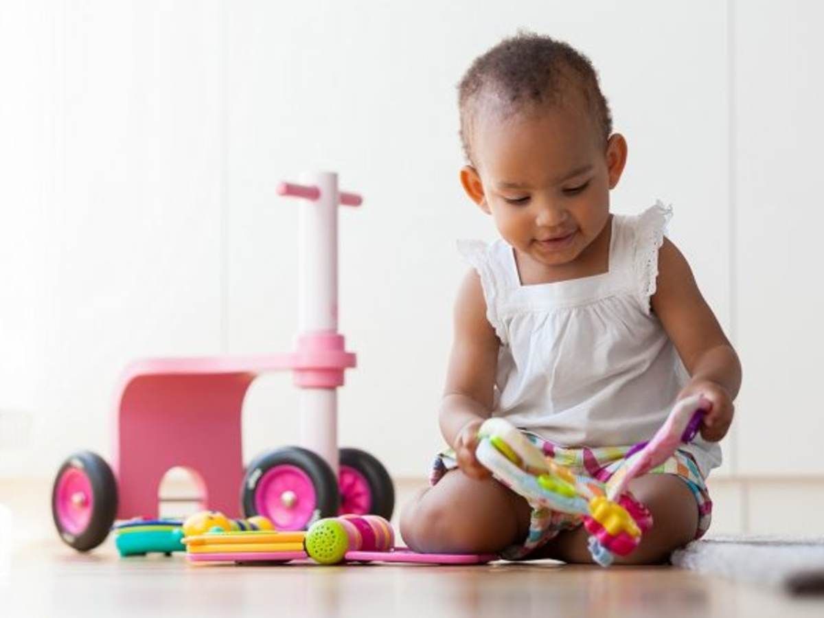 little toddler playing with toys
