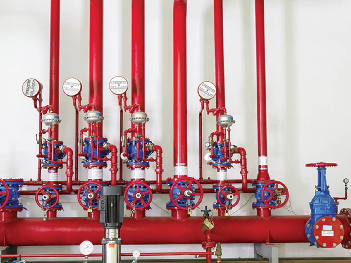Red pumps and valves in a fire station. 