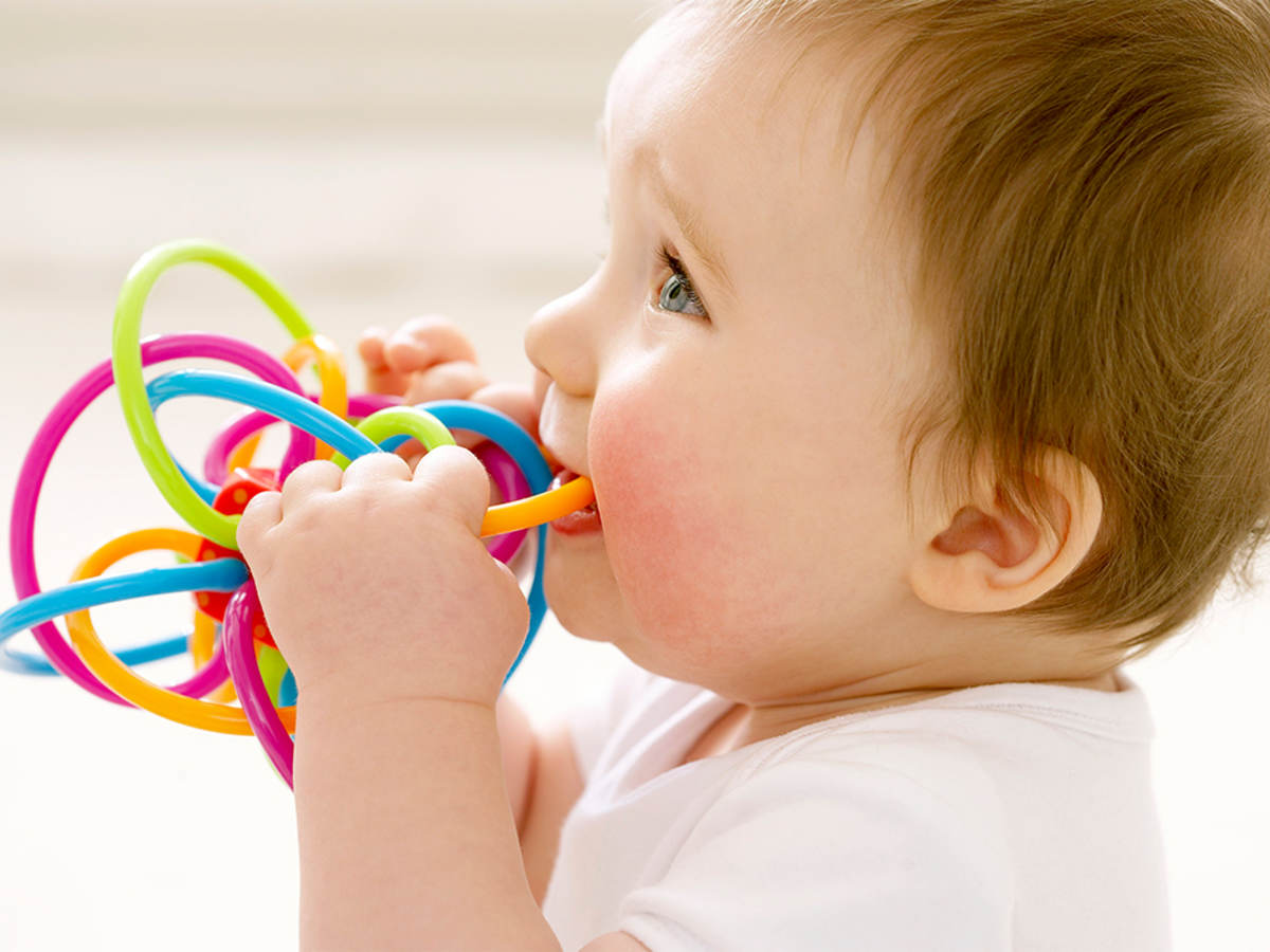 Baby playing with a teething toy 
