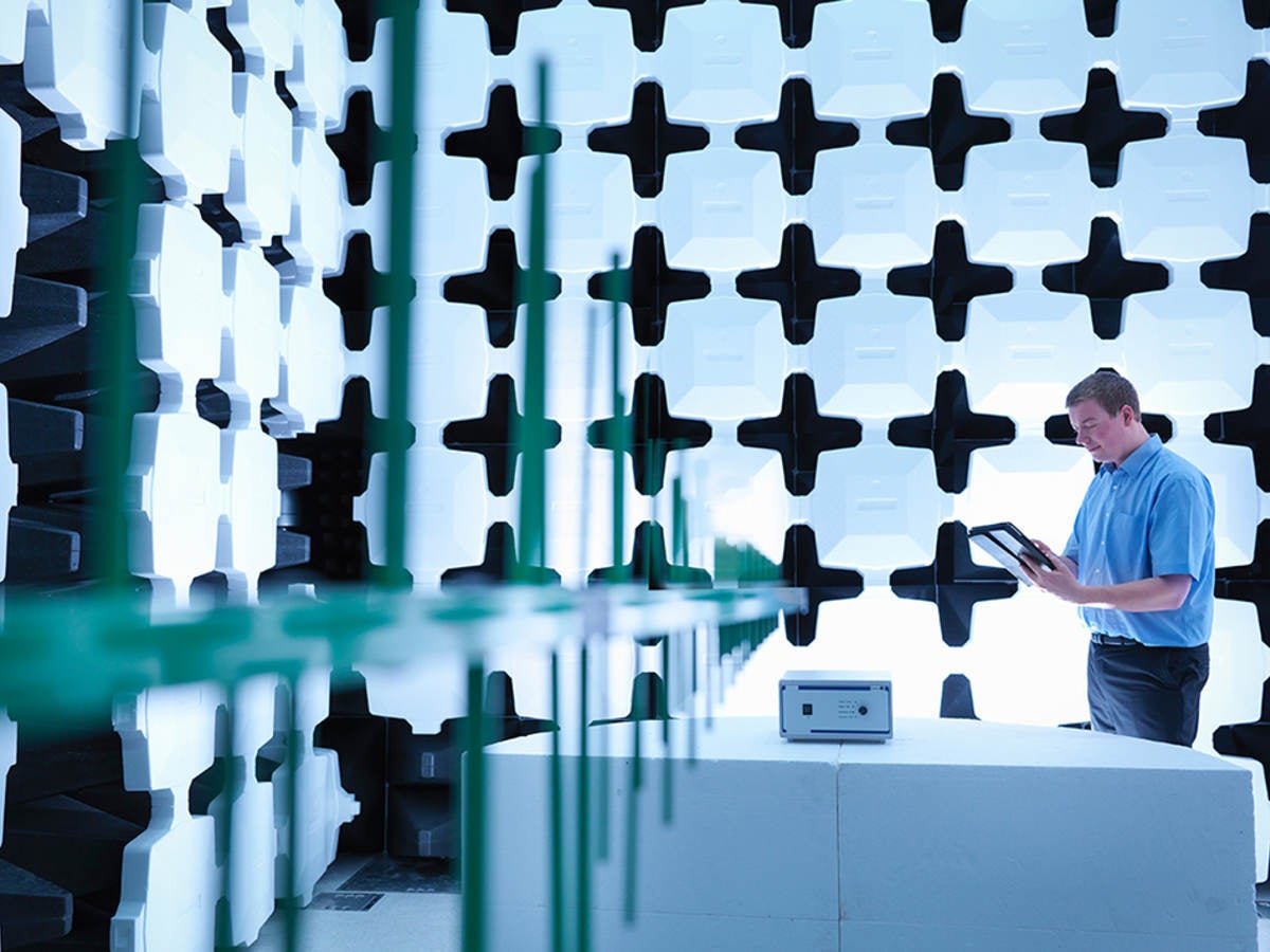 Man conducting electromagnetic compatibility (EMC) testing 